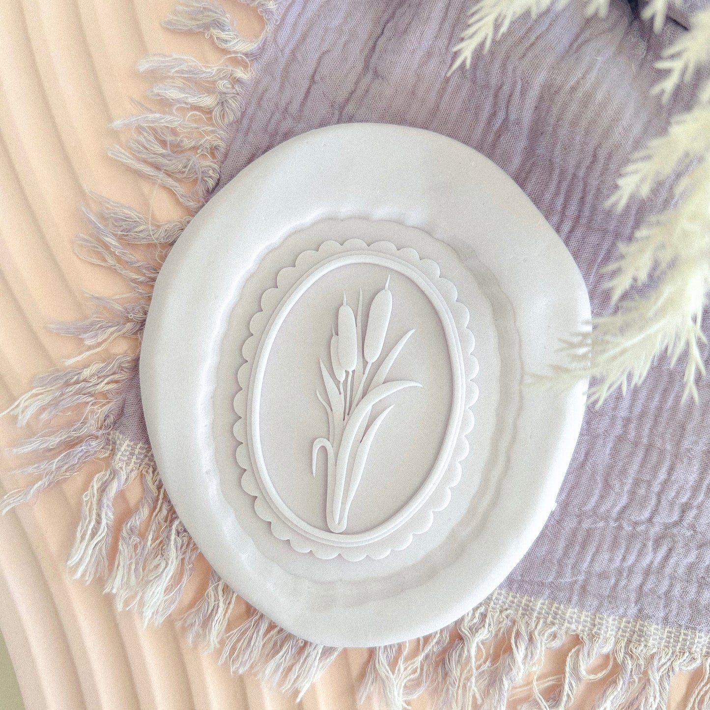 Reeds In Scalloped Oval