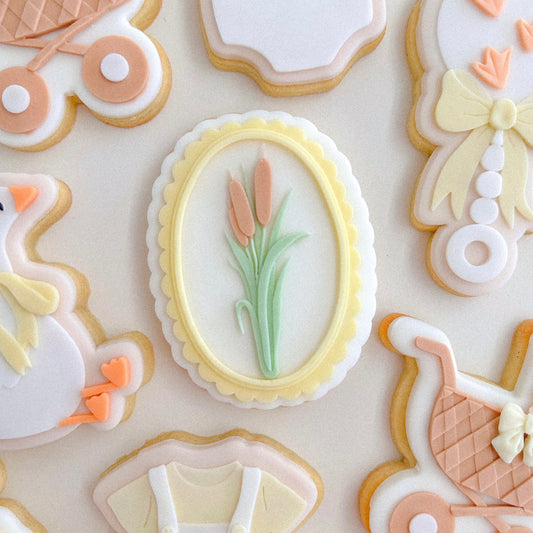 Reeds In Scalloped Oval